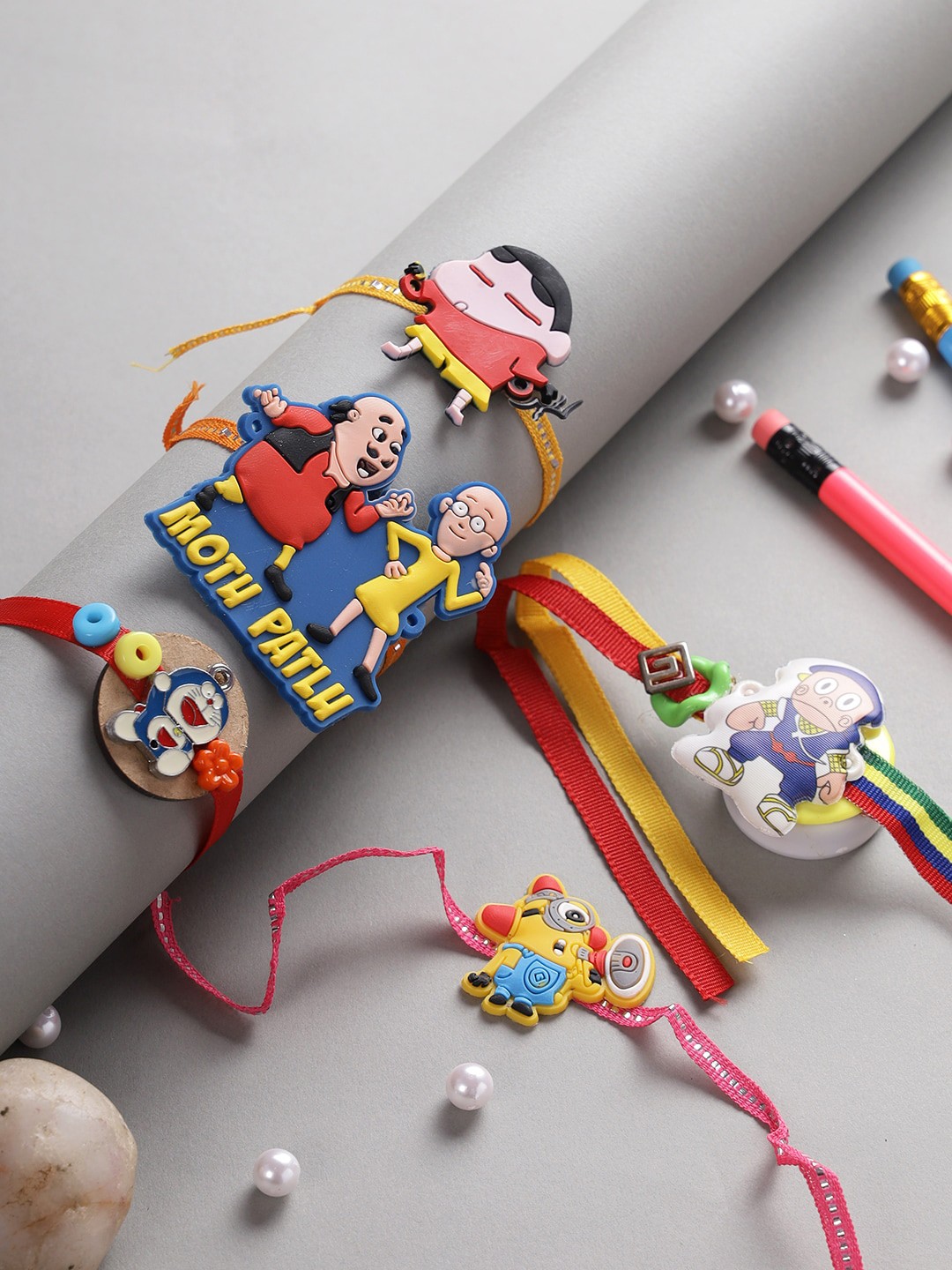 

Aapno Rajasthan Set Of 5 Cartoon Characters Beaded Rakhi, Multi