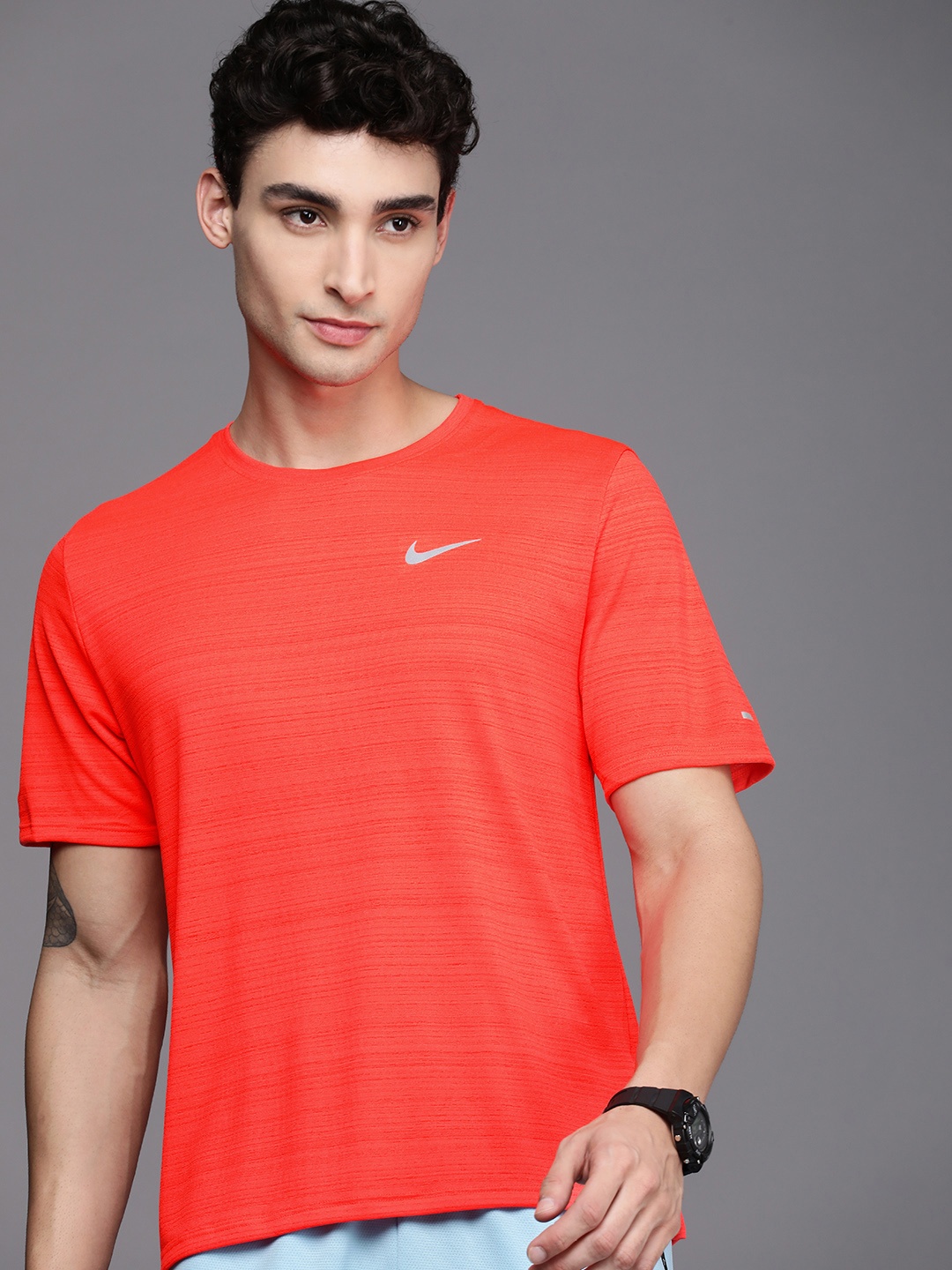 

Nike Men Coral Orange Solid Dri-FIT DF MILER Running T-shirt