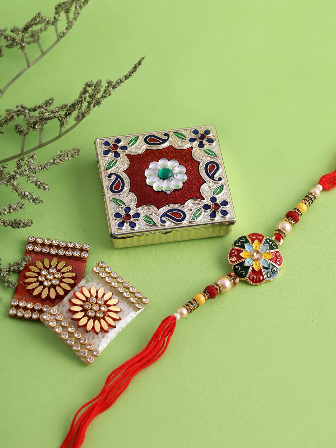 

Aapno Rajasthan Gold-Toned & Red Beaded Rakhi