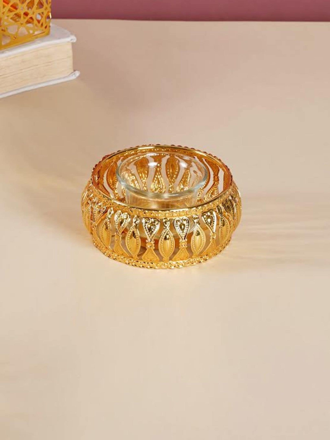 

Nestasia Gold & Transparent Spherical Metal & Glass Candle Stand