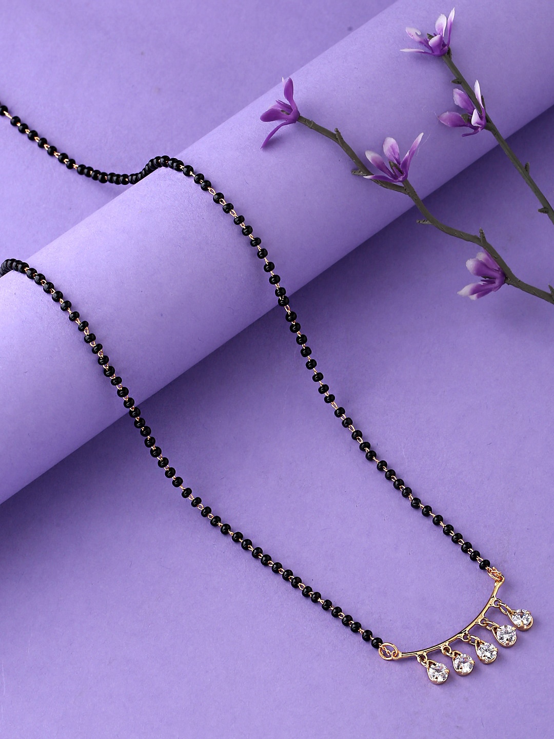 

Yellow Chimes Women Gold-Plated Black AD Stone-Studded & Beaded Mangalsutra