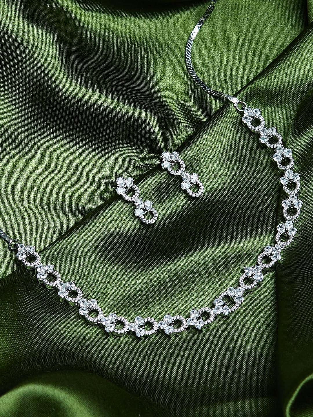 

Voylla Rhodium-Plated Silver-Coloured & White Stone Studded & Beaded Jewellery Set