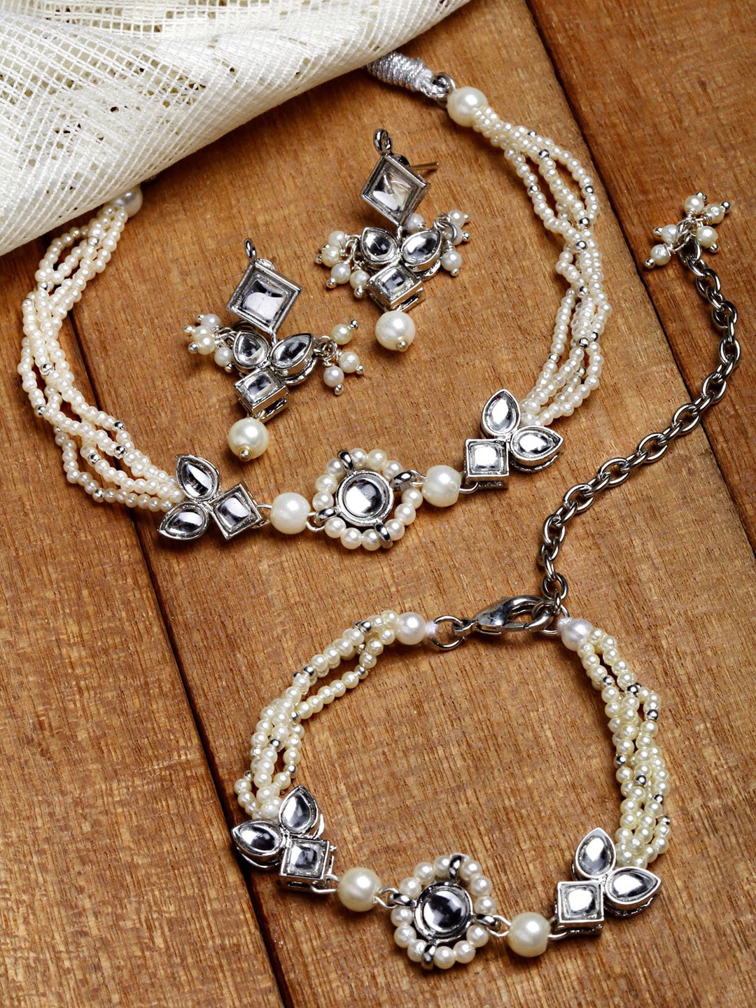 

KARATCART Women Oxidised Silver-Toned & White Kundan-Studded Jewellery Set