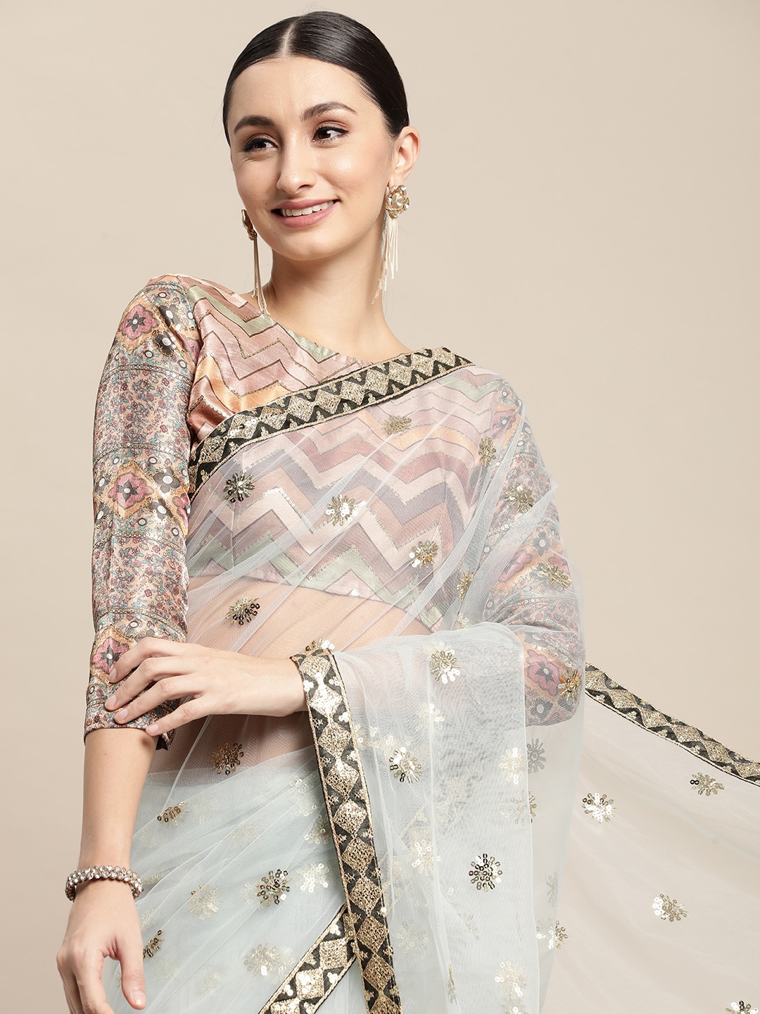 

VAIRAGEE Blue Floral Sequinned Net Saree