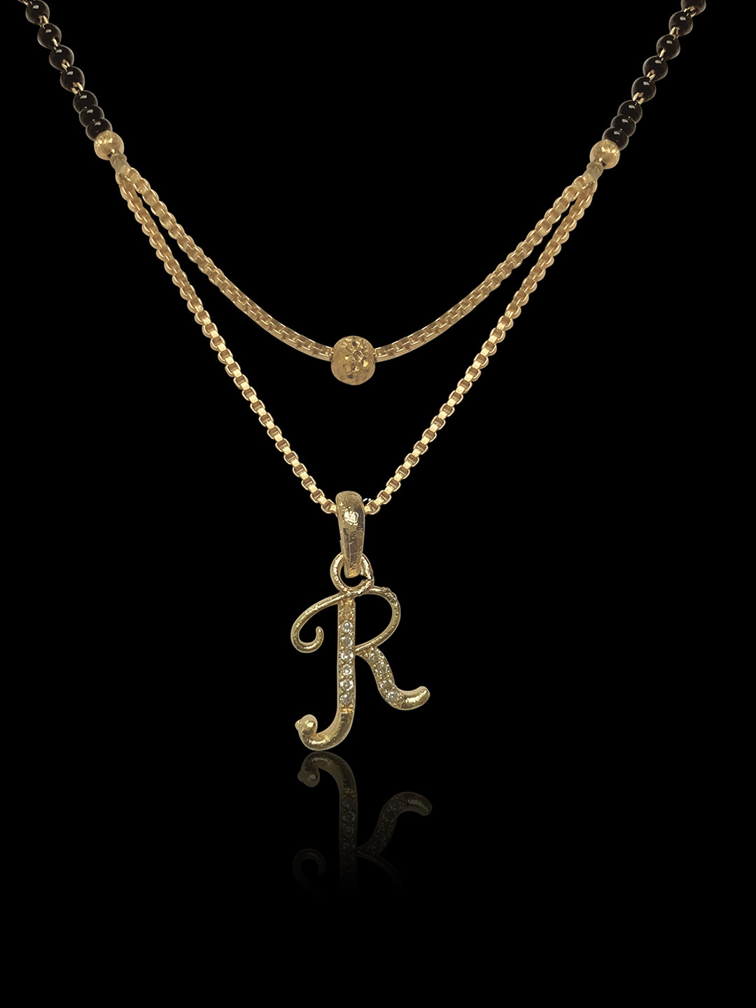 

ANNA CREATIONS Women Gold-Plated Black Stone Studded & Beaded Mangalsutra