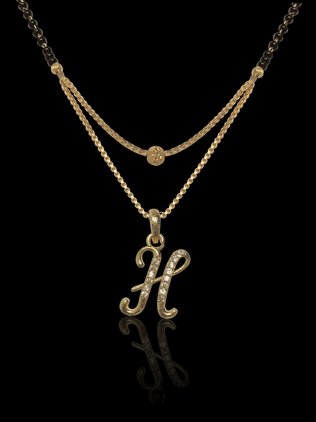 

ANNA CREATIONS Gold-Plated White Stone-Studded & Black Beaded H-Charm Mangalsutra