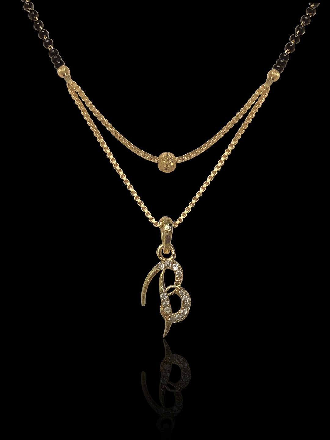 

ANNA CREATIONS Women Gold-Plated Black & White Stone-Studded Beaded Mangalsutra