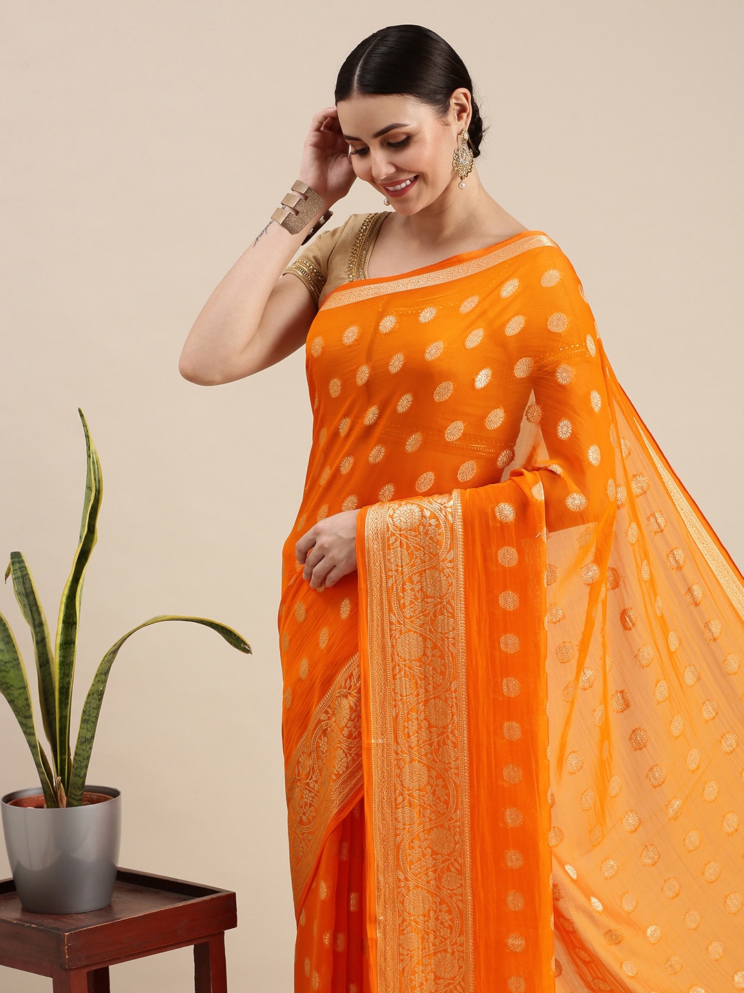 

Rani Saahiba Orange & Golden Woven Design Saree