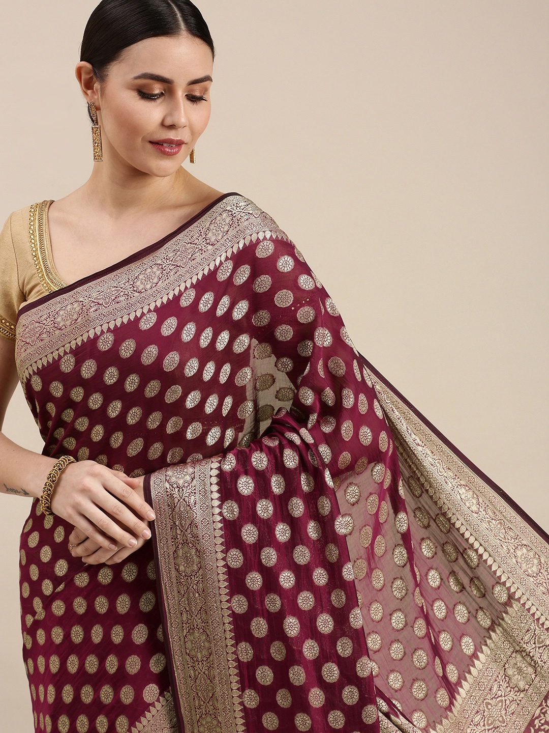 

Rani Saahiba Burgundy & Golden Woven Design Saree