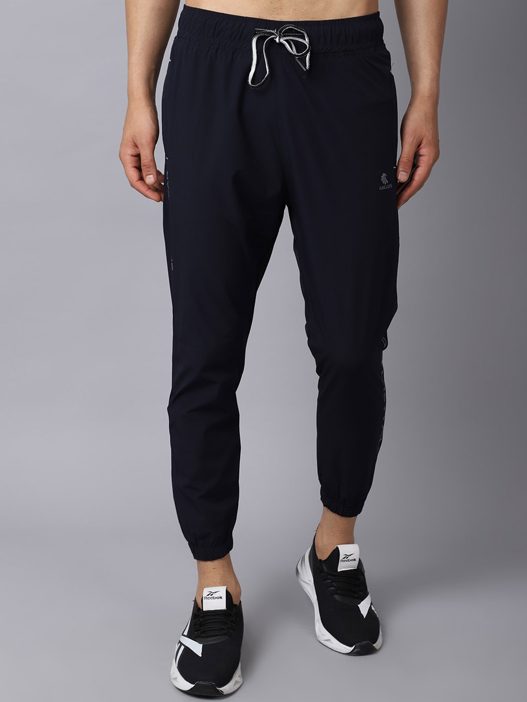 

Gallus Men Navy Blue Solid Self Design Joggers