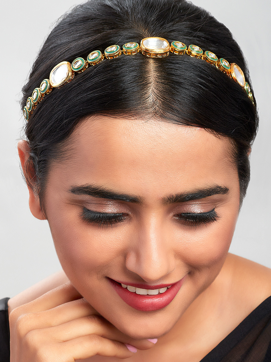 

Ahaanya Gold-Plated Green & White Kundan Studded Enamelled Maatha Patti