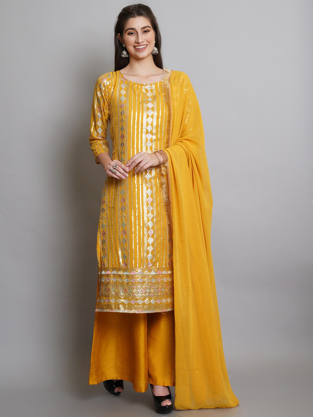 

Stylee LIFESTYLE Yellow & Silver-Toned Embellished Semi-Stitched Dress Material