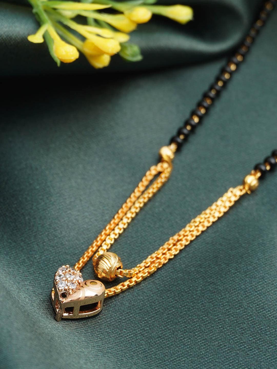 

Urmika Gold-Plated AS Studded Black Beads Mangalsutra