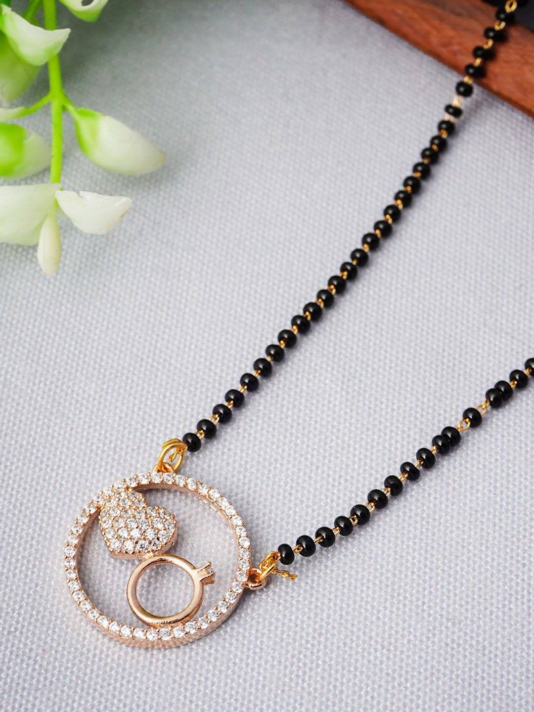 

Urmika Rose Gold-Plated AD-Studded and Beaded Mangalsutra