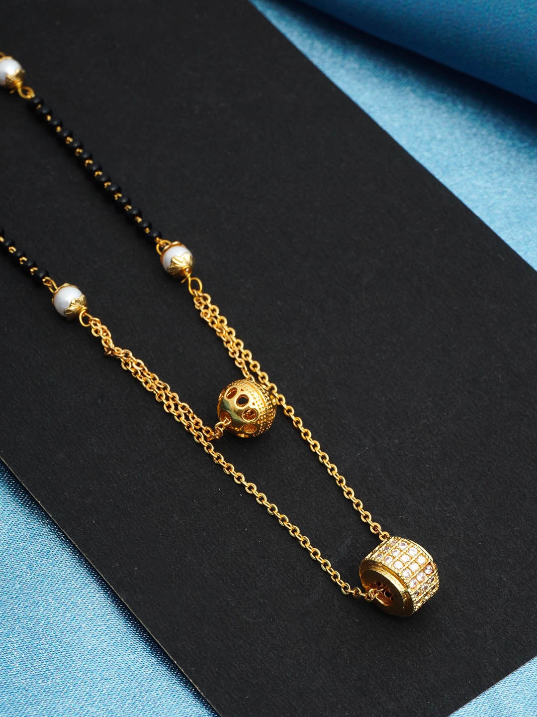 

Urmika Gold-Plated AD-Studded and Beaded Mangalsutra