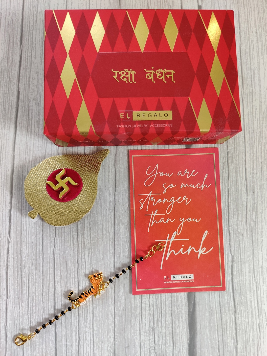 

EL REGALO Gold-Toned Orange Coloured Evil Eye Baby Rakhi Set
