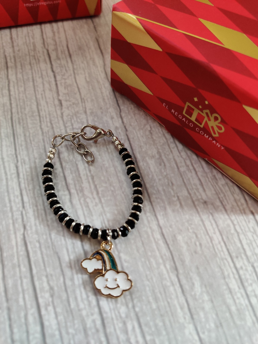 

EL REGALO Silver Coloured Black Evil Eye Baby Rakhi With Greeting Card