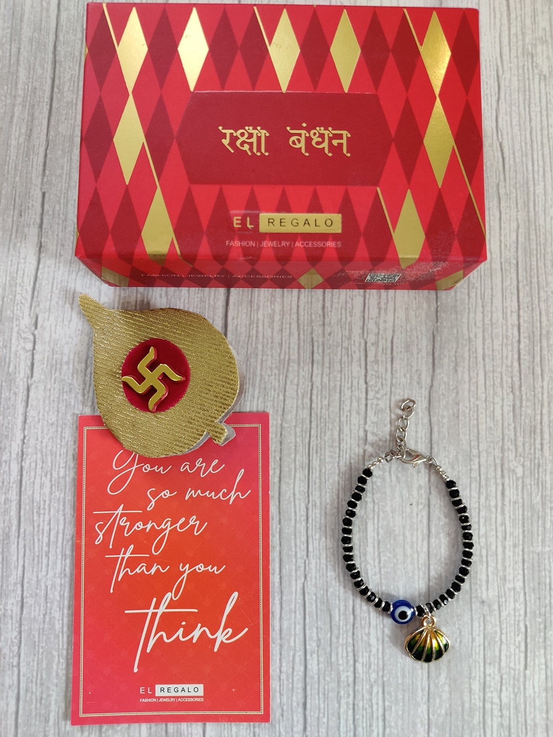 

EL REGALO Blue Black Evil Eye Baby Rakhi With Roli Chawal Raksha Bandhan Greeting Card