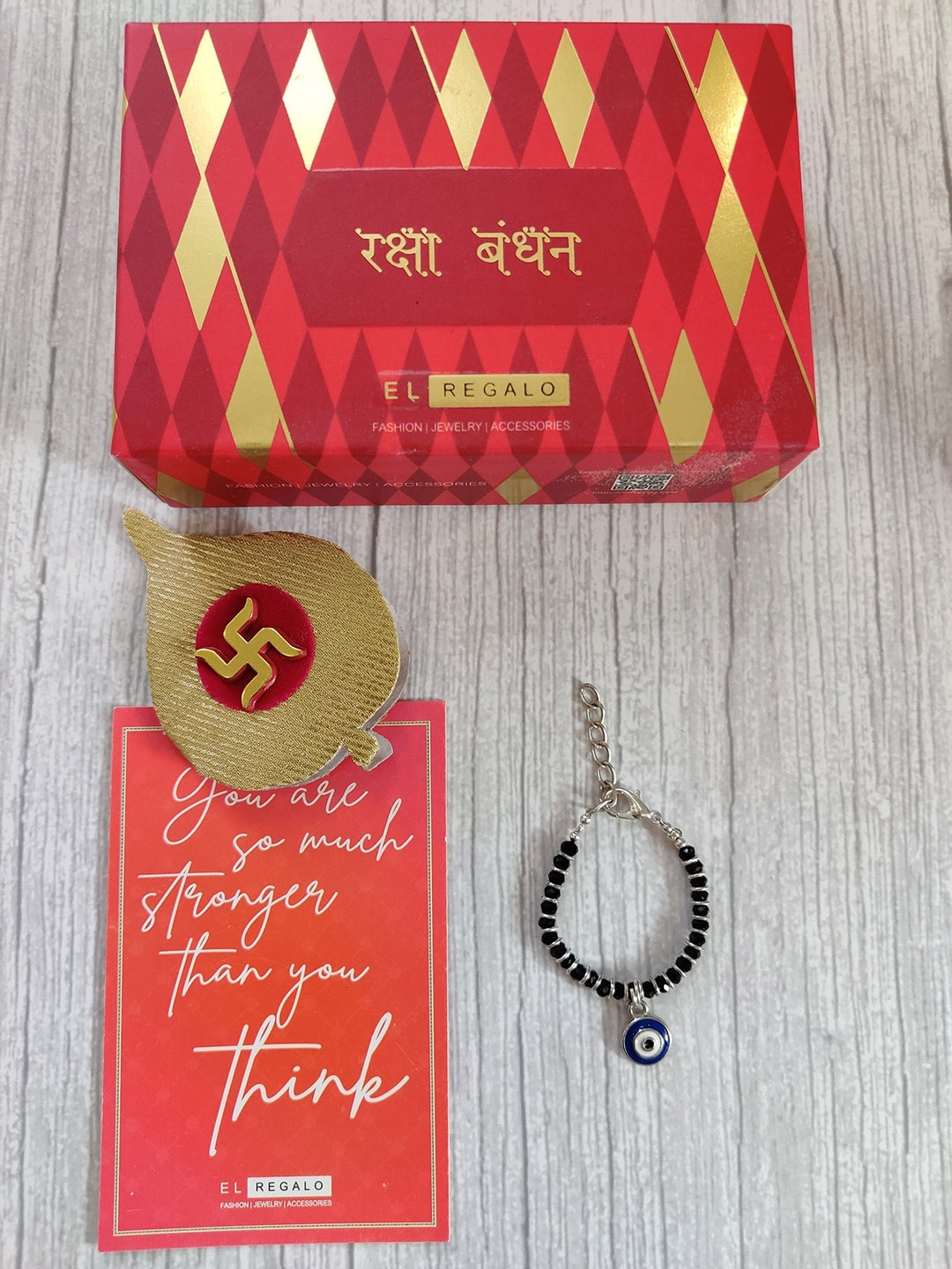

EL REGALO Baby White Black Evil Eye Rakhi With Roli Chawal Combo Sets