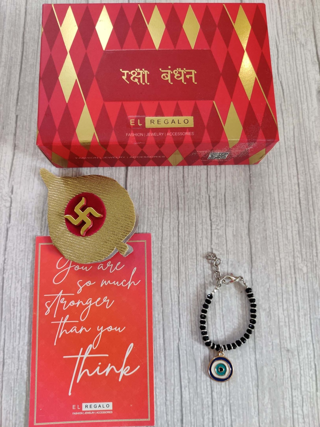 

EL REGALO Baby Blue Black Evil Eye Wrap Around Rakhi, Greeting Card Roli Chawal