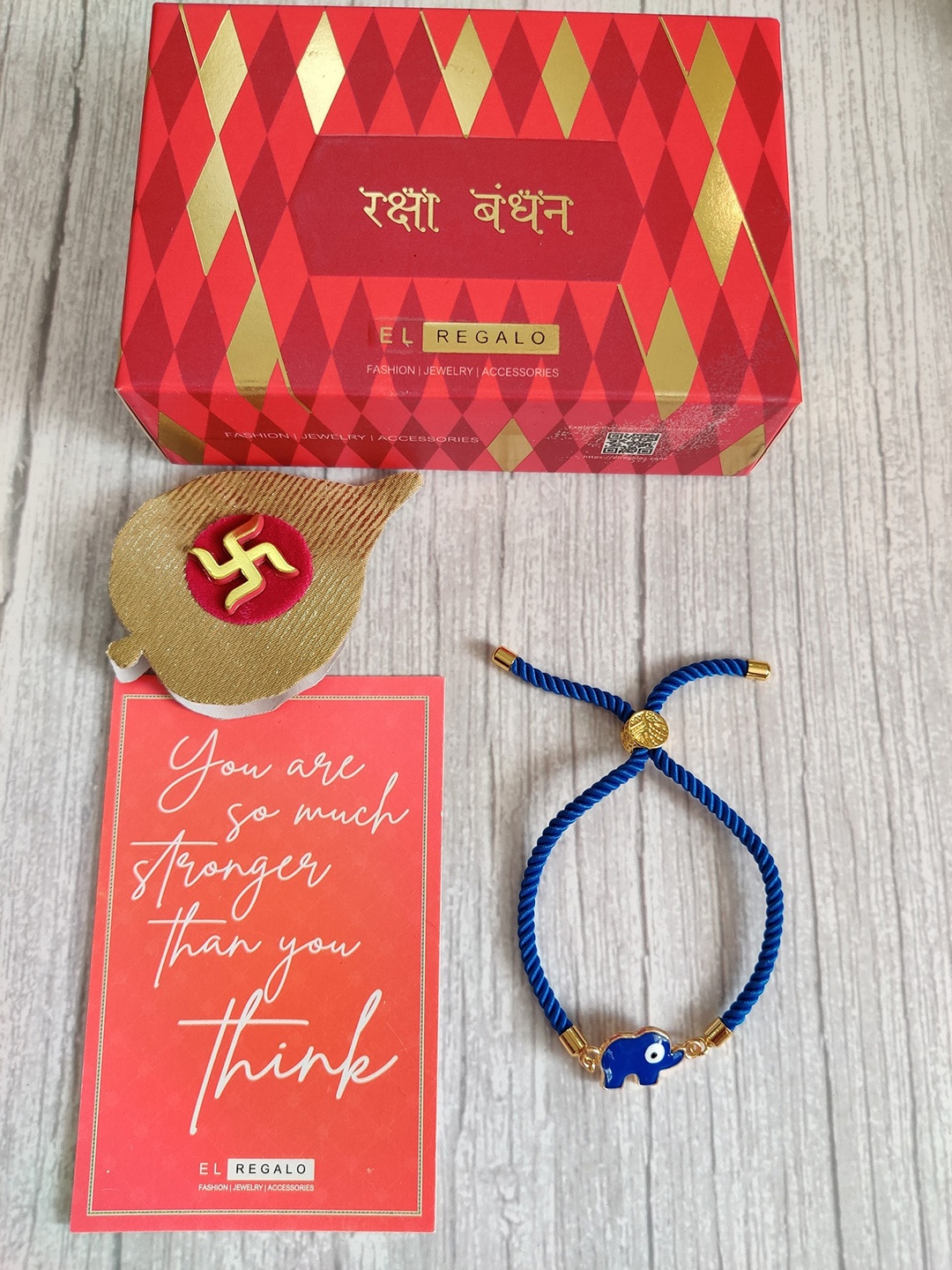 

EL REGALO Blue & Gold Coloured Evil Eye Wrap Around Rakhi With Roli Chawal & Raksha Bandhan Greeting Card