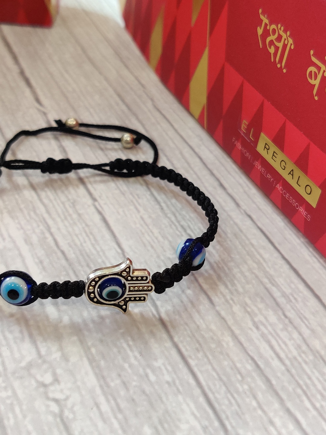 

EL REGALO Blue & Black Evil Eye Wrap Around Rakhi With Roli Chawal & Raksha Bandhan Greeting Card