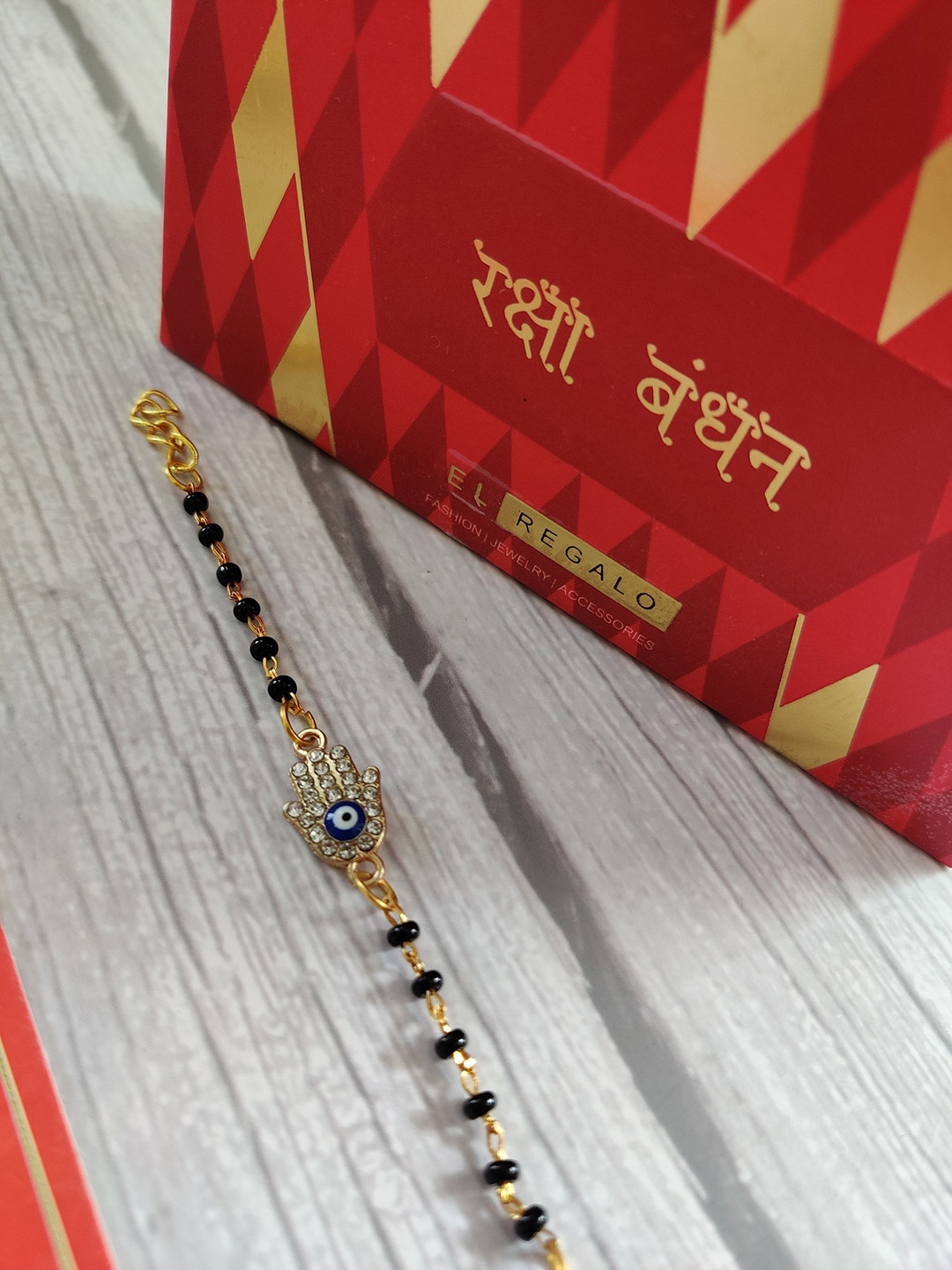 

EL REGALO Gold-Toned Kids Black Beaded Rakhi for Baby and Infants