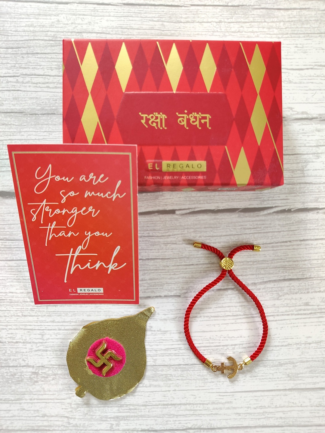 

EL REGALO Gold-Plated Red zodiac sign Rakhi with Greeting card & Roli Chawal