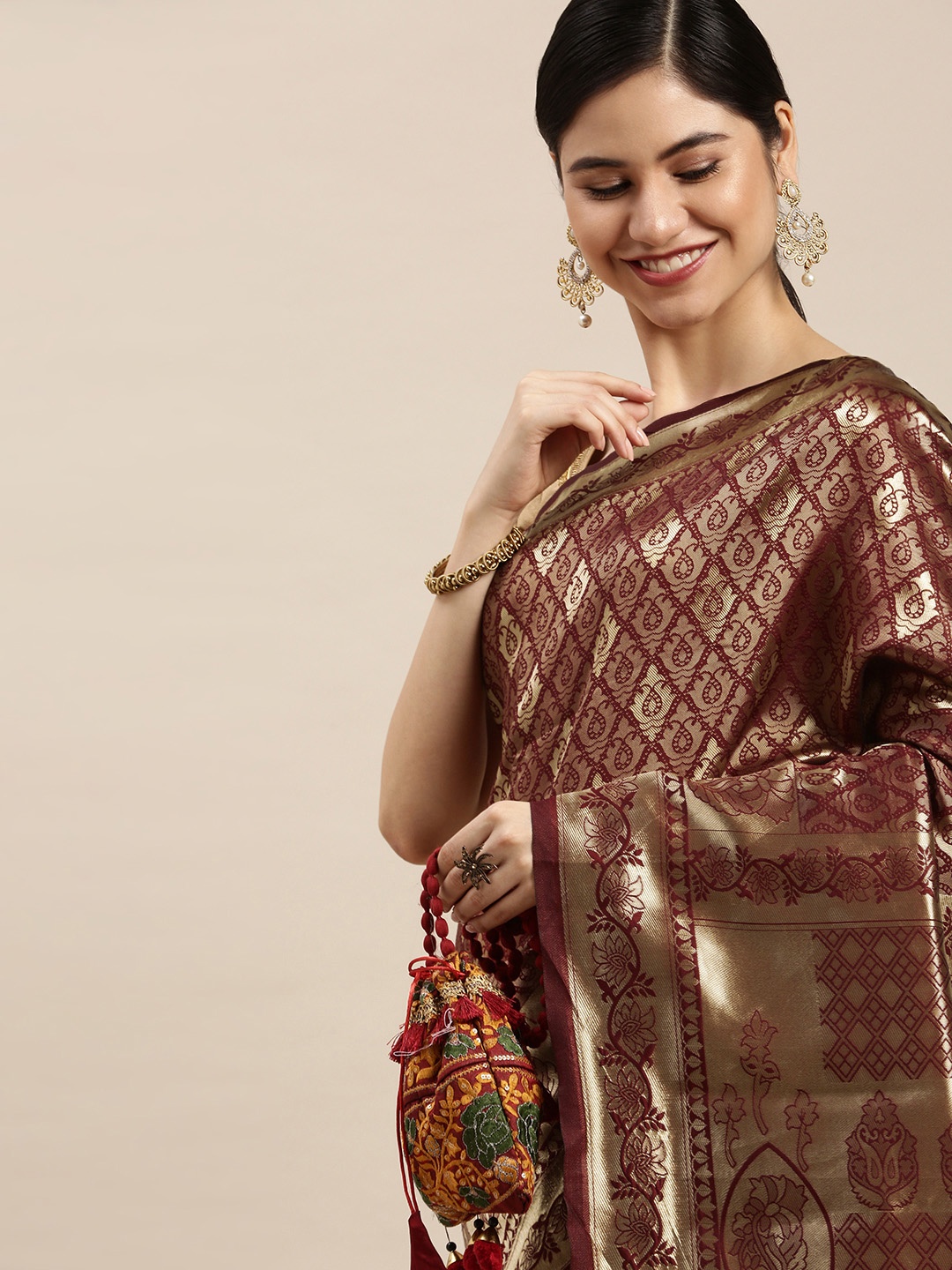 

Hinayat Fashion Maroon & Golden Woven Design Zari Saree