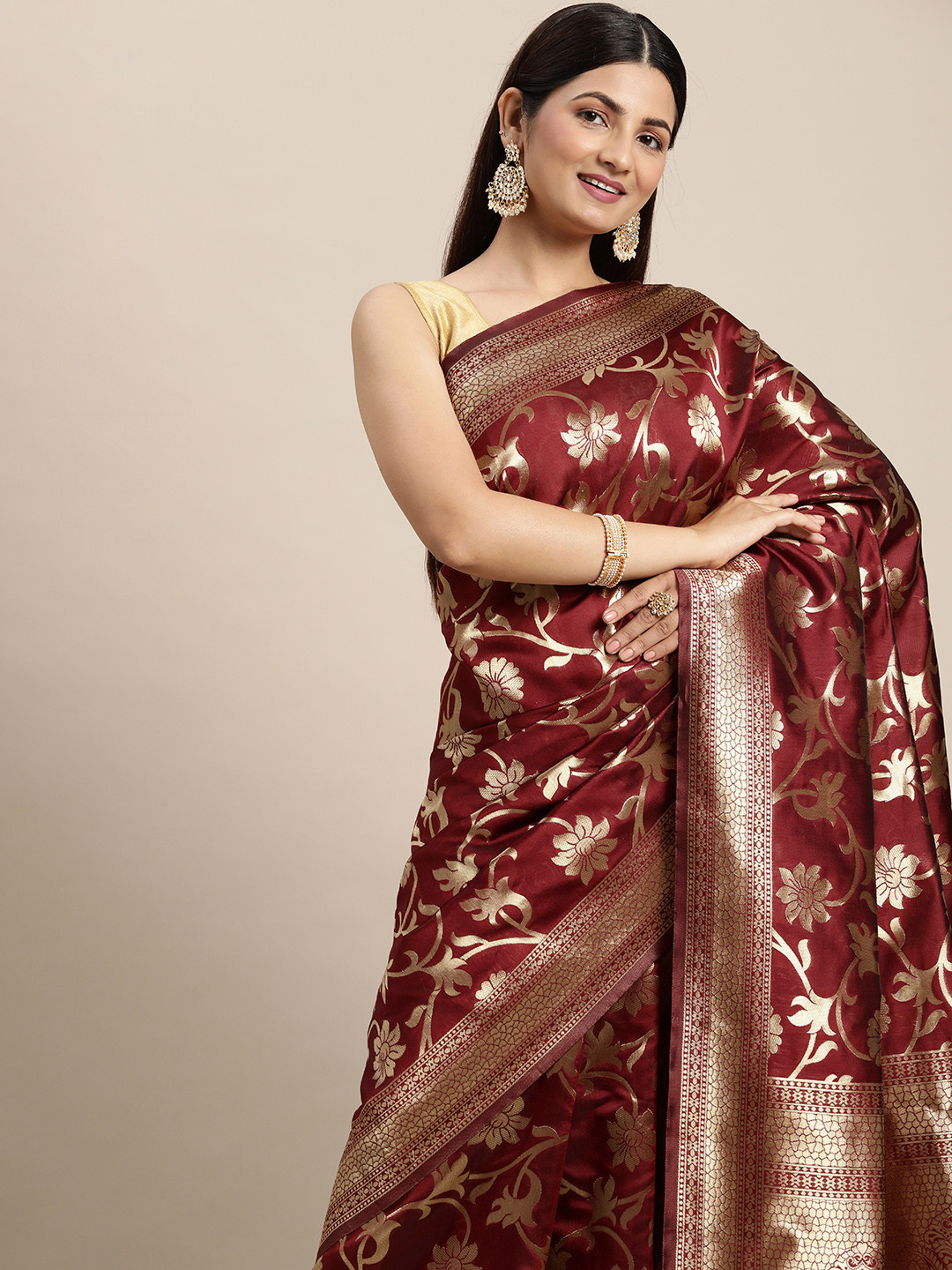 

Hinayat Fashion Maroon & Golden Ethnic Motifs Zari Silk Blend Saree