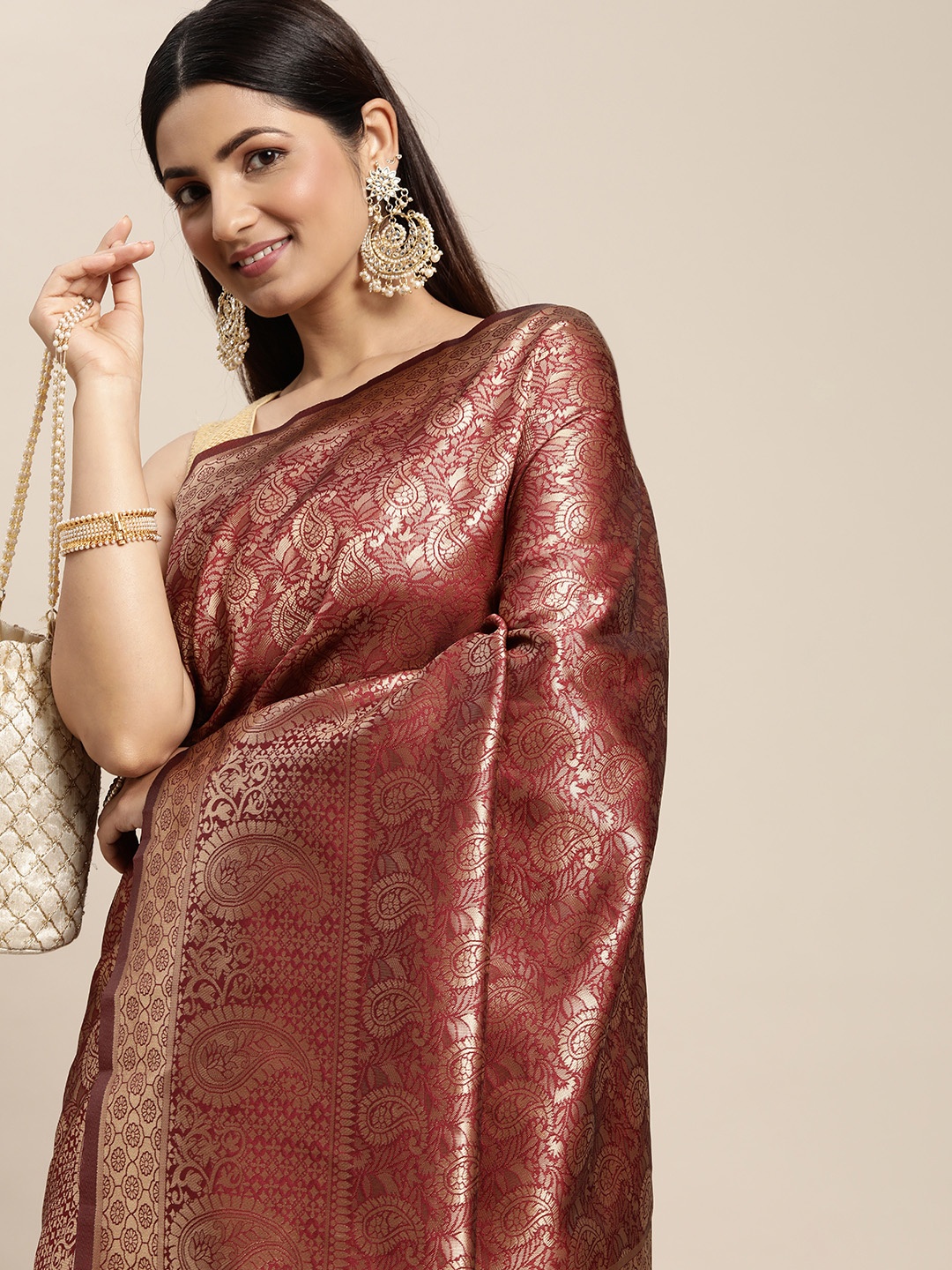 

Hinayat Fashion Maroon Ethnic Motifs Zari Silk Blend Banarasi Saree