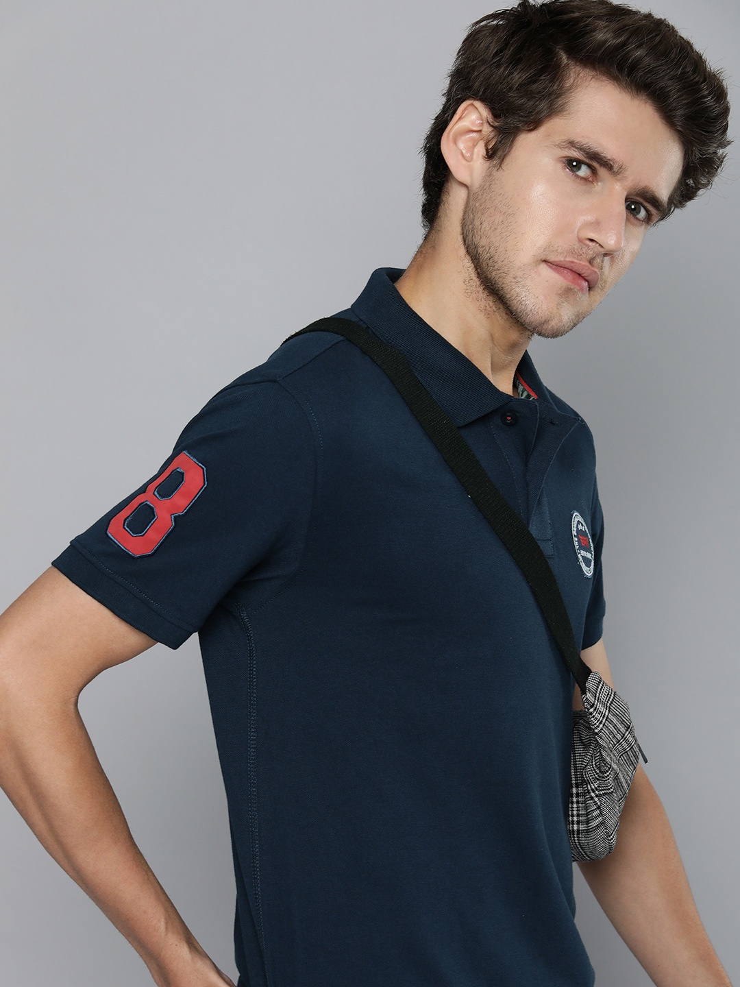 

Flying Machine Men Navy Blue Solid Polo Collar Applique T-shirt