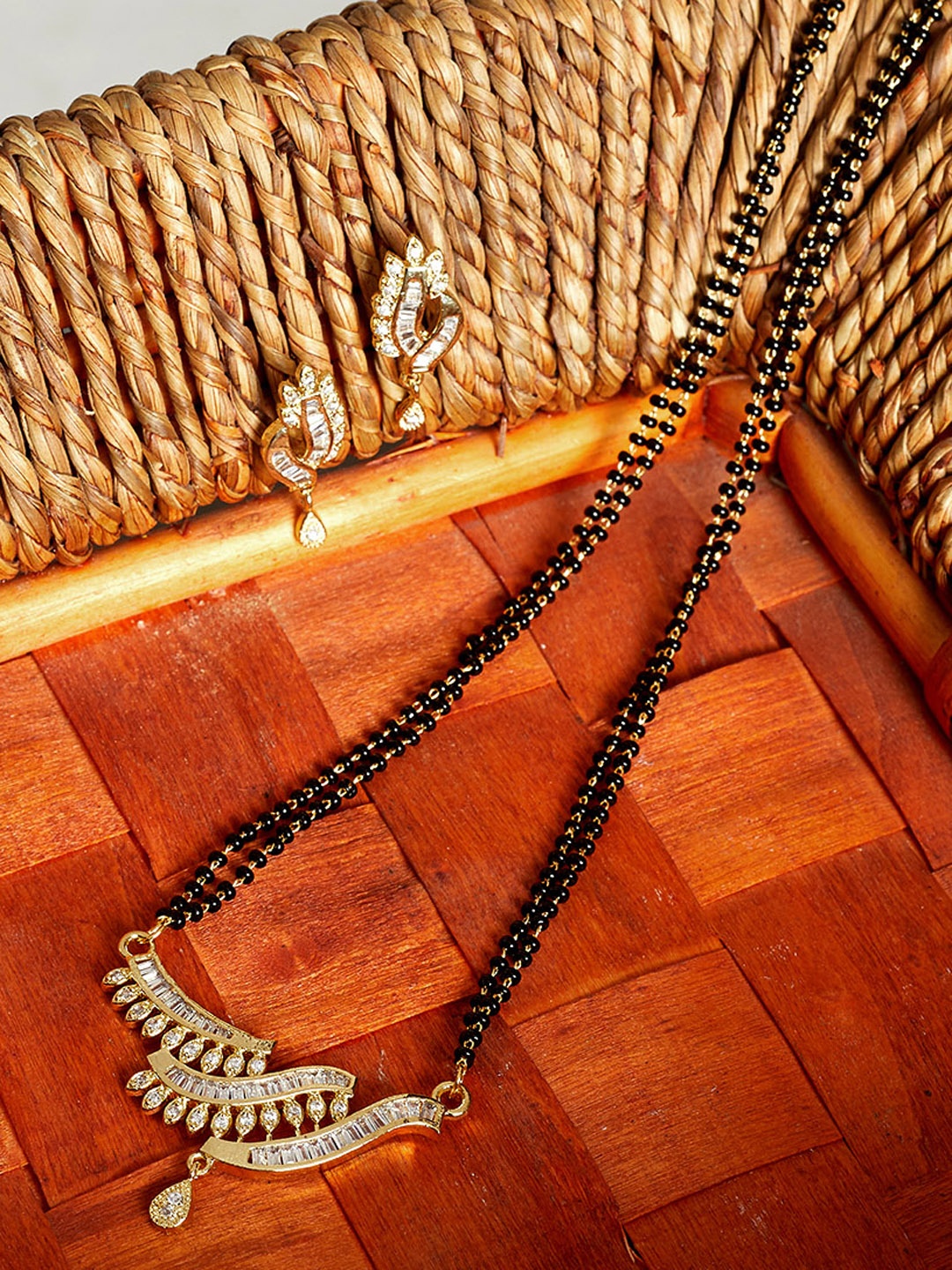 

PANASH Gold-Plated White & Black Stone Studded & Beaded Mangalsutra