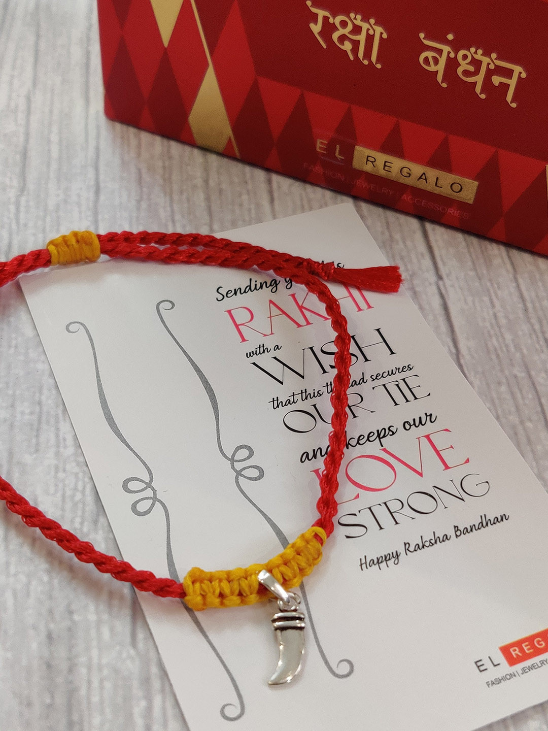 

EL REGALO Red 925 Real Silver Rakhi Set