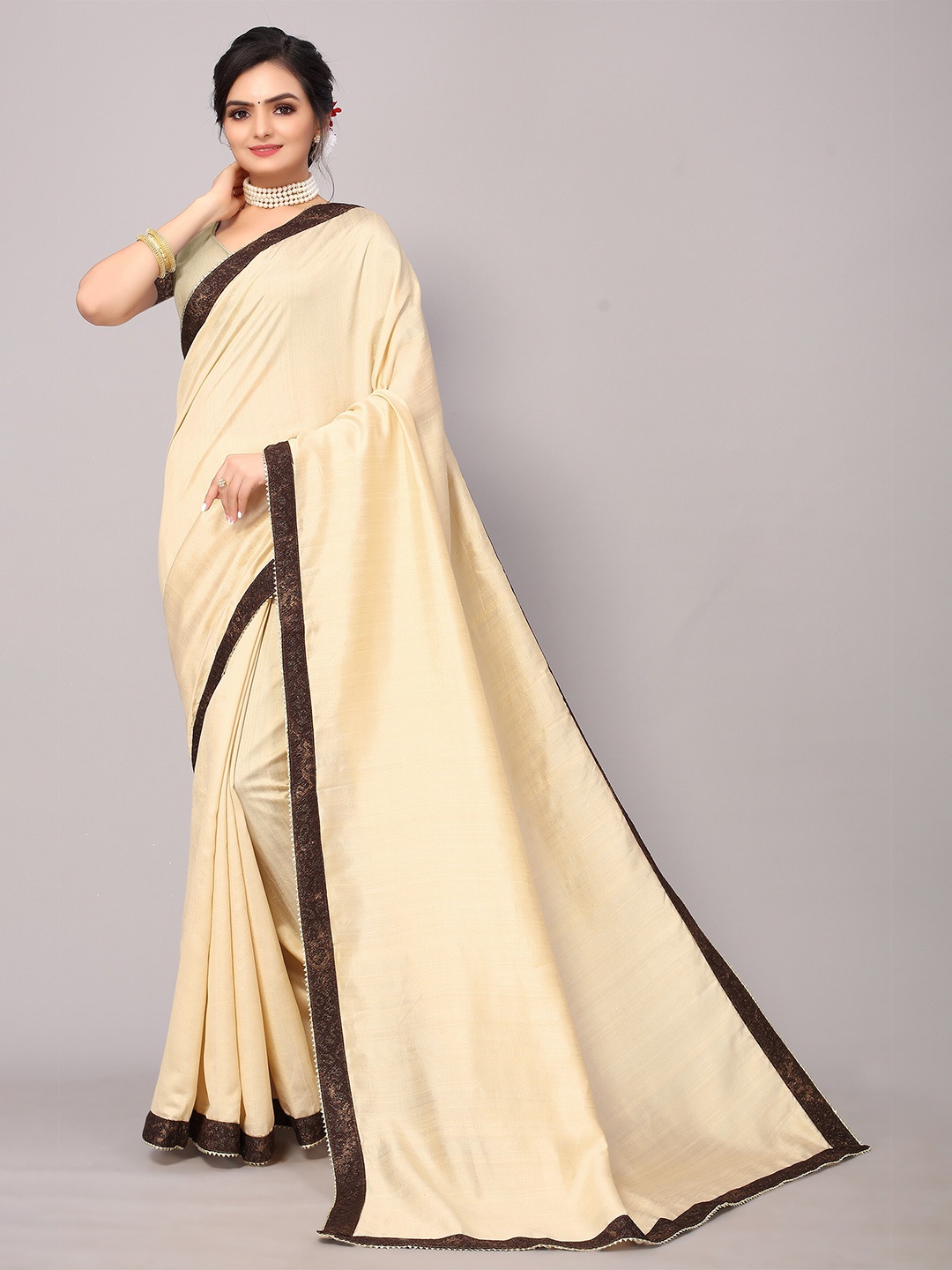 

KALINI Beige Poly Silk Woven Border Saree With Matching Blouse.
