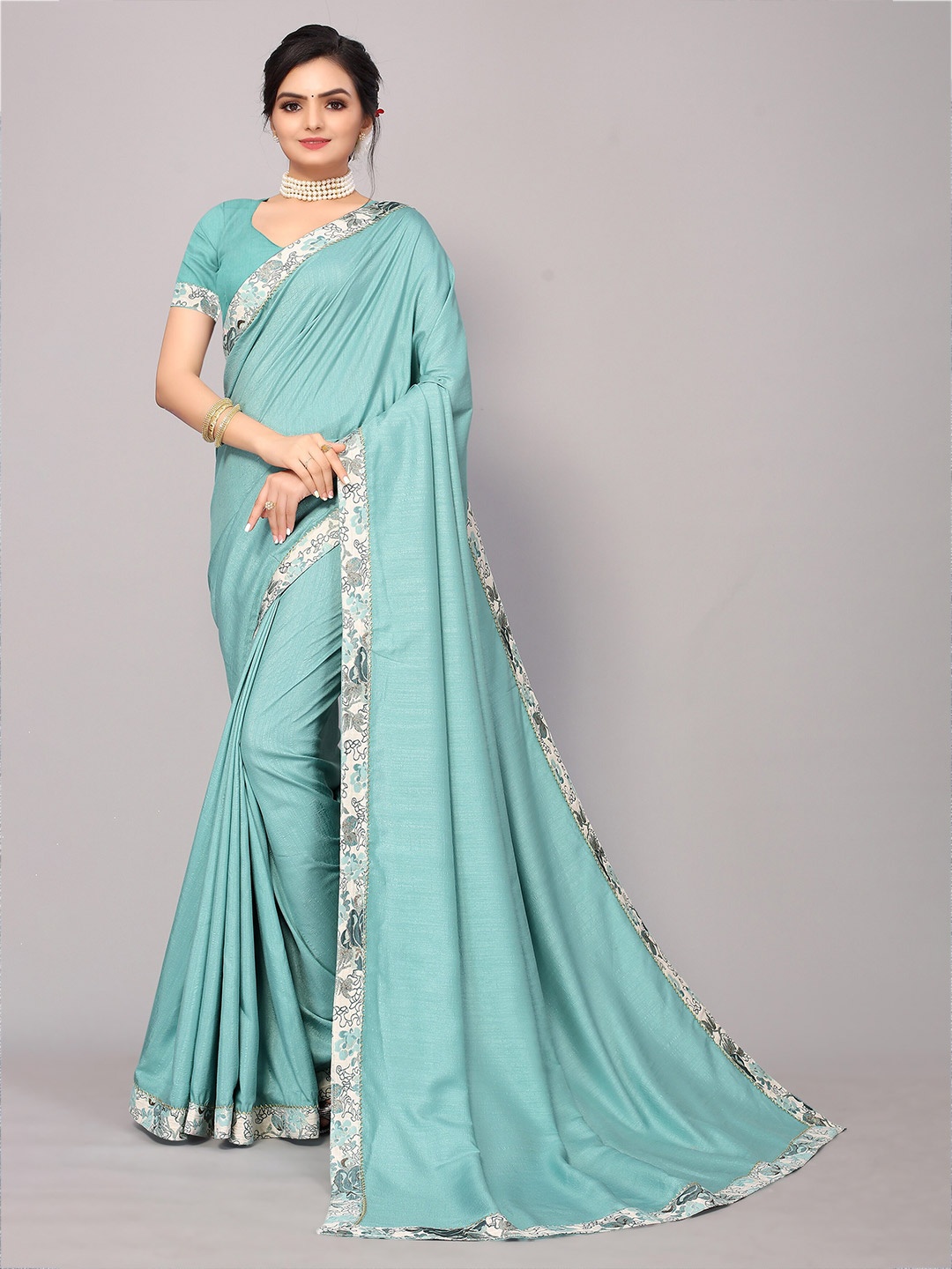 

KALINI Teal & Silver-Toned Zari women Saree