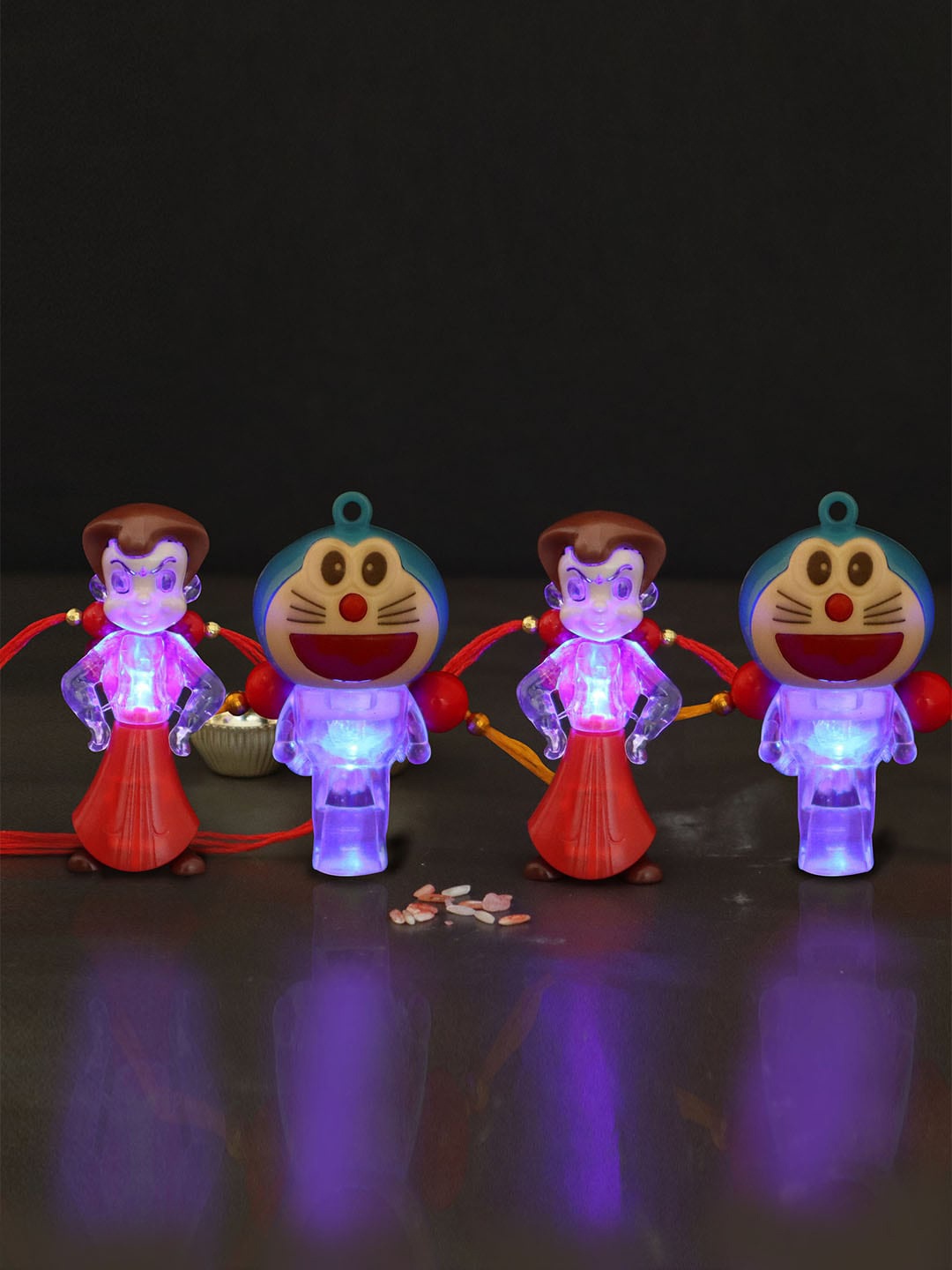 

TIED RIBBONS Set Of 4 Assorted LED Light Kids Rakhi with Roli Chawal and Card, Red