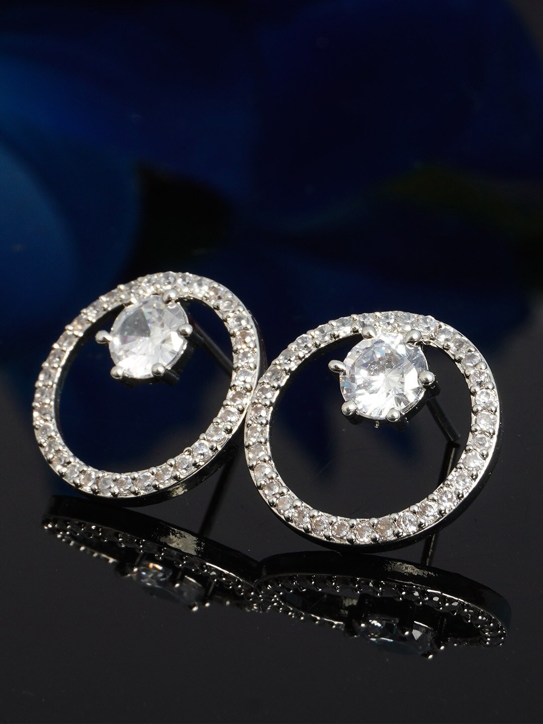 

Urmika Silver-Toned & White Circular Crystals Studs Earrings