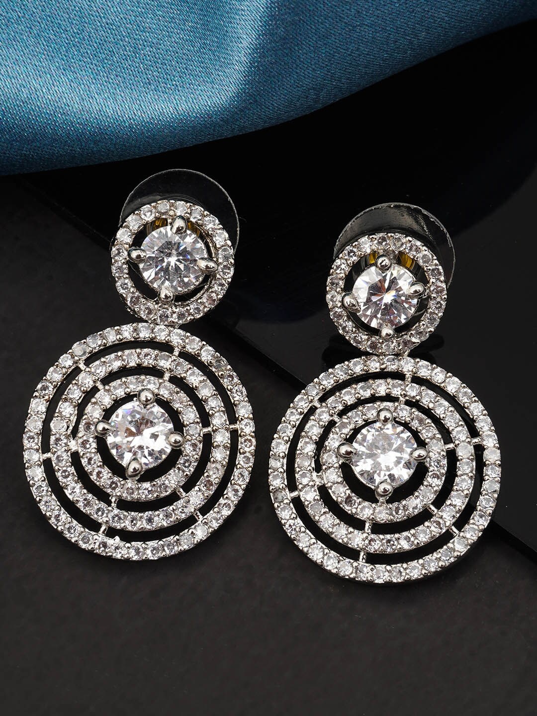 

Urmika Women White Circular Drop Earrings