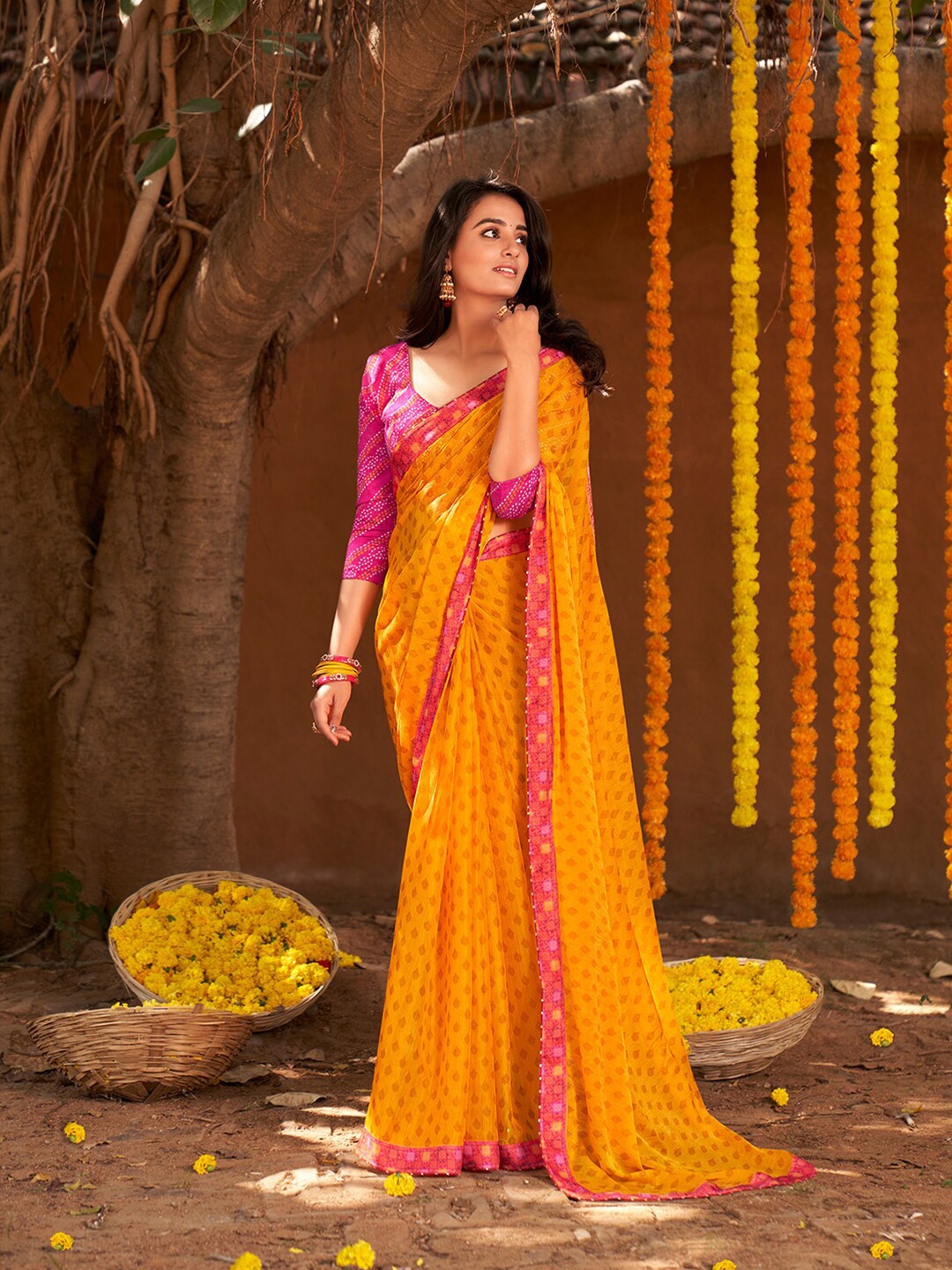 

Shaily Yellow & Pink Ethnic Motifs Pure Chiffon Saree