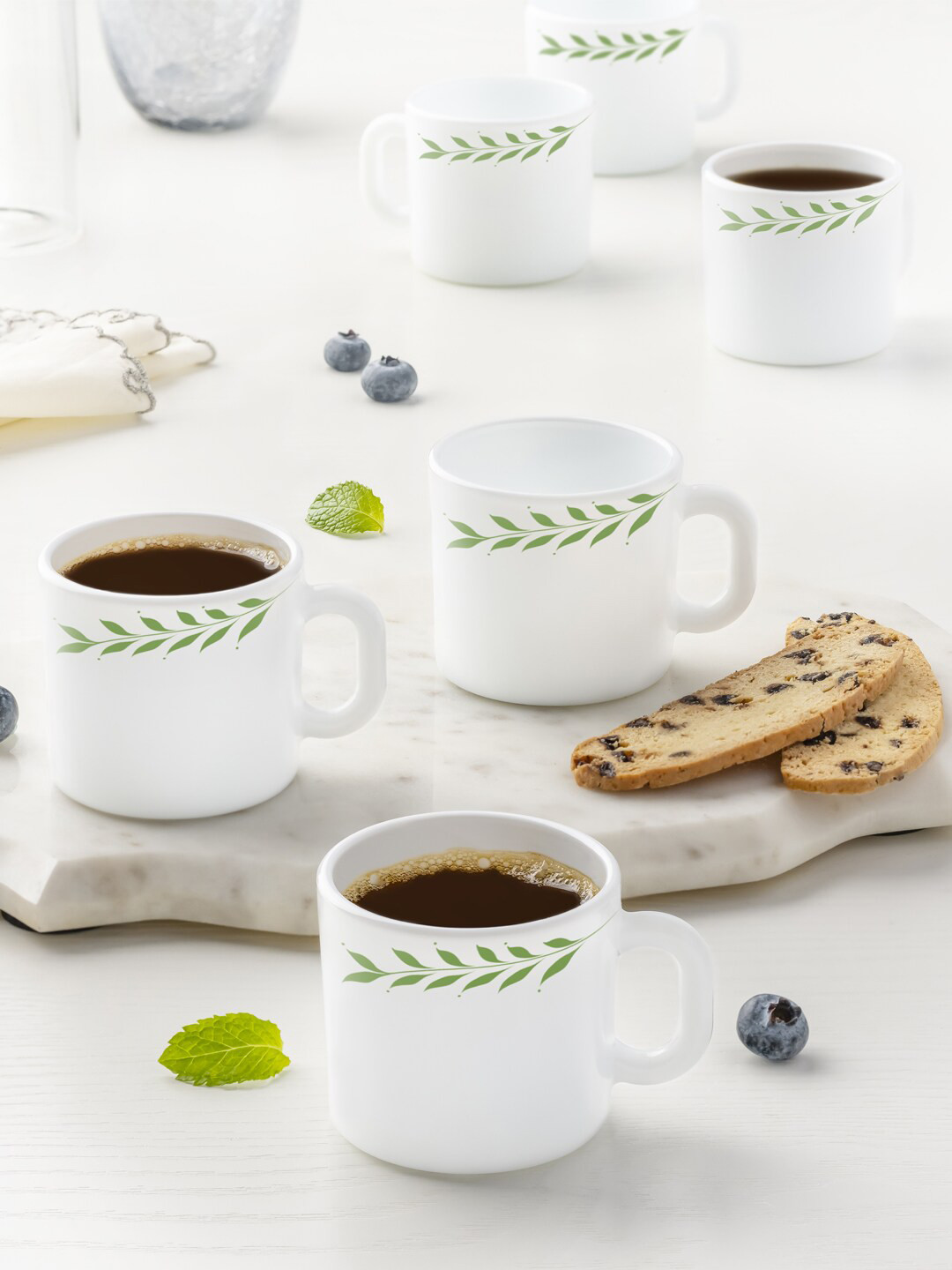 

Larah by BOROSIL White & Green Hand Painted Printed Opalware Glossy Mugs Set of Cups and Mugs
