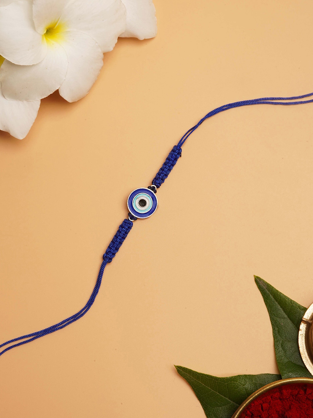 

TEEJH Men Silver-Toned & Blue Threaded Round Shaped Rakhi