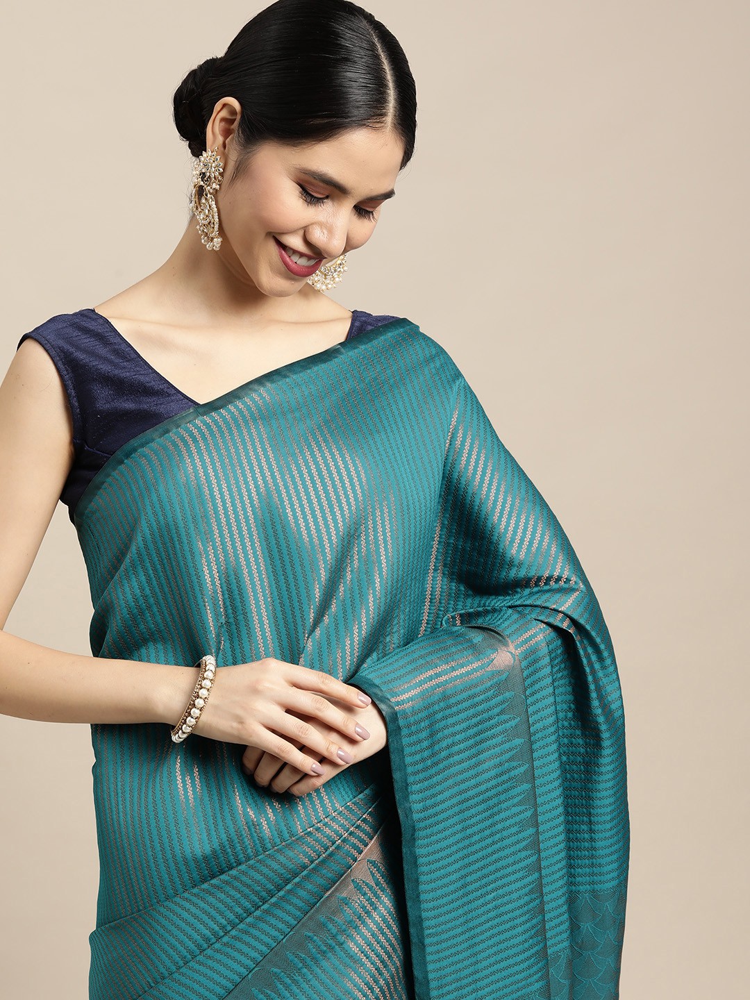 

Mitera Blue & Copper Striped Zari Kanjeevaram Saree