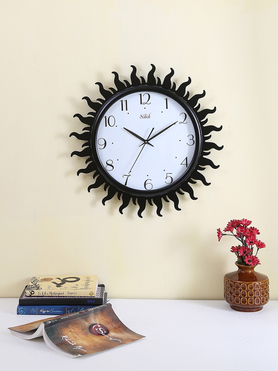 

Safal Brown & Transparent Dial 40 cm x 40 cm Sun-Shaped Analogue Wall Clock, White