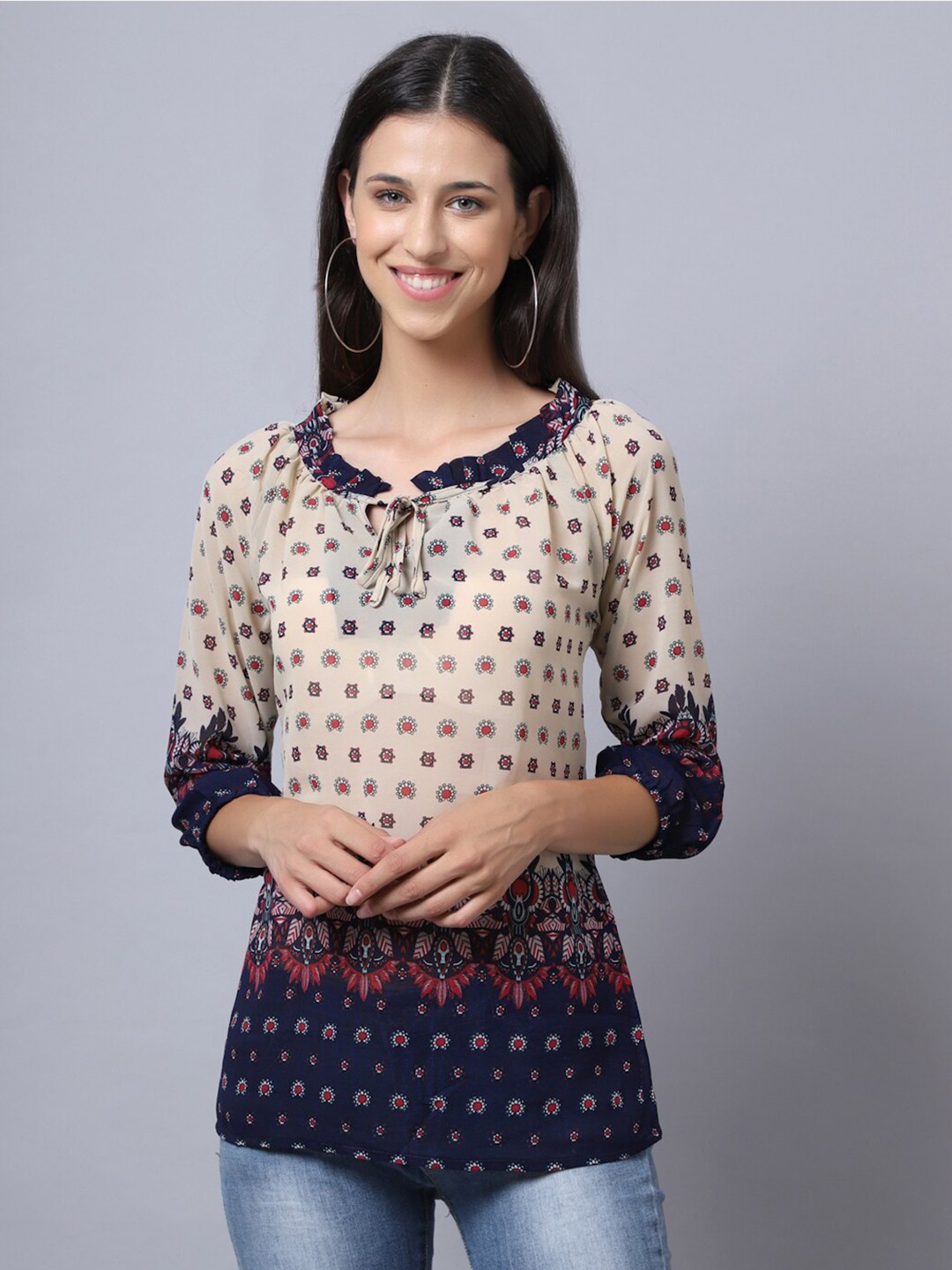 

Rute Cream-Coloured & Navy Blue Printed Tie-Up Neck Longline Top