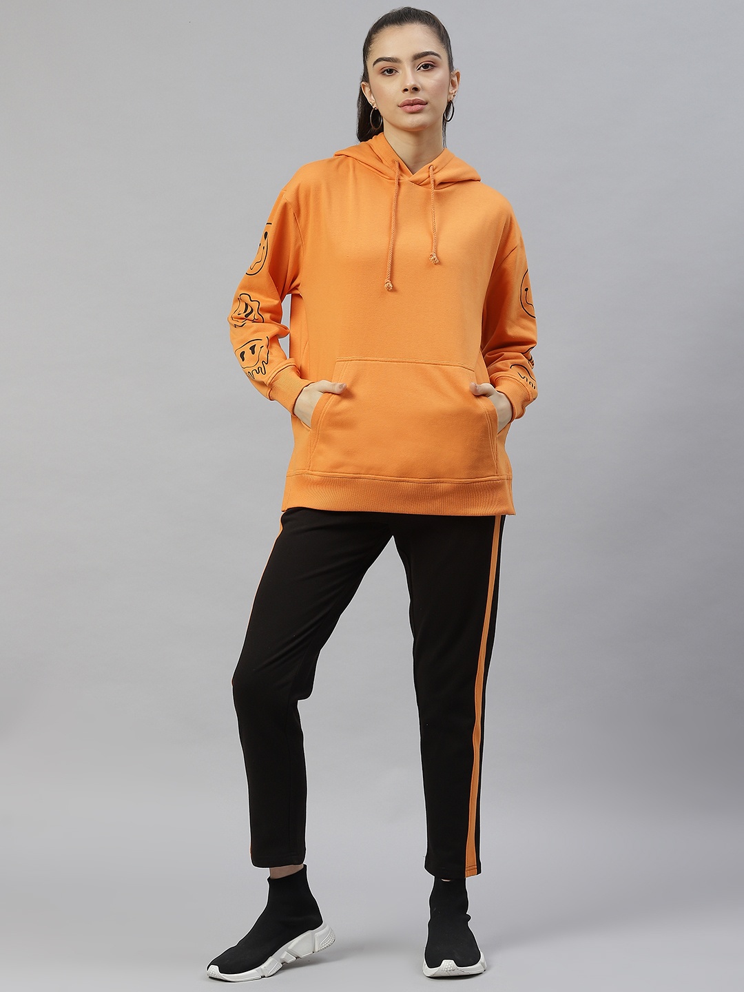 

Laabha Women Orange & Black Solid Tracksuit