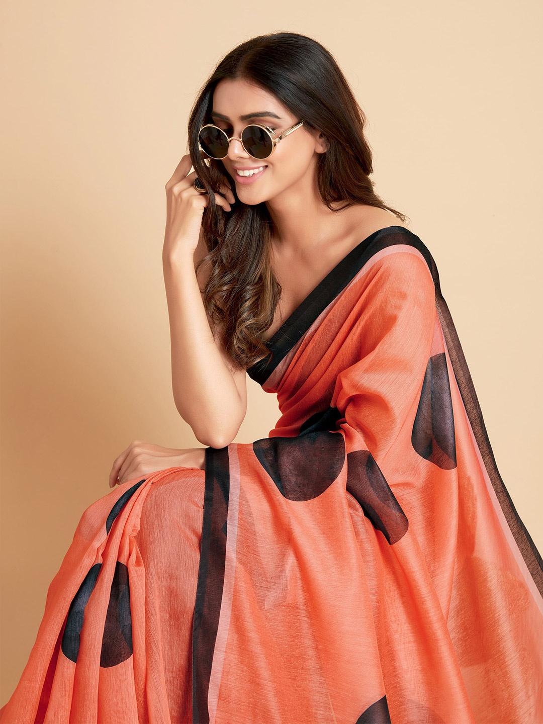 

Sangria Peach-Coloured & Black Saree