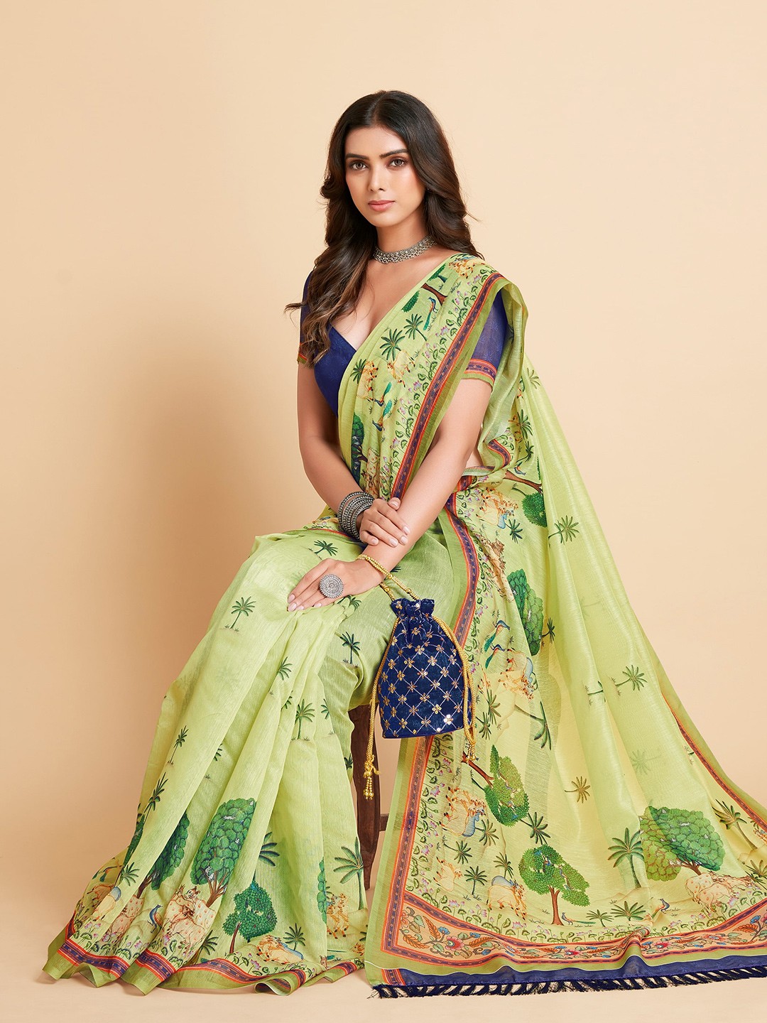

Sangria Green & Blue Ethnic Motifs Saree
