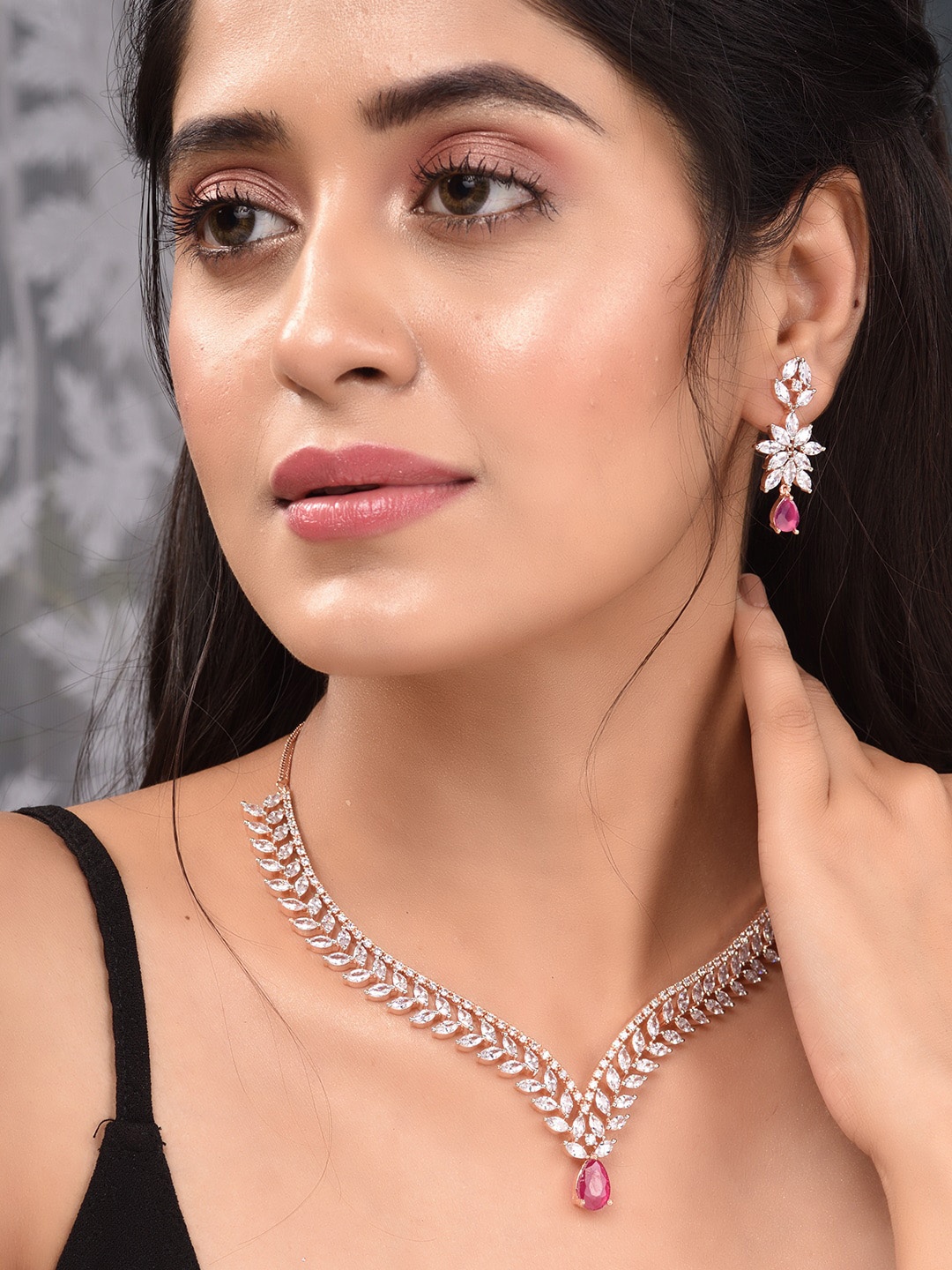 

Saraf RS Jewellery Women Rose Gold-Plated Red & White AD Studded Handcrafted Jewellery Set