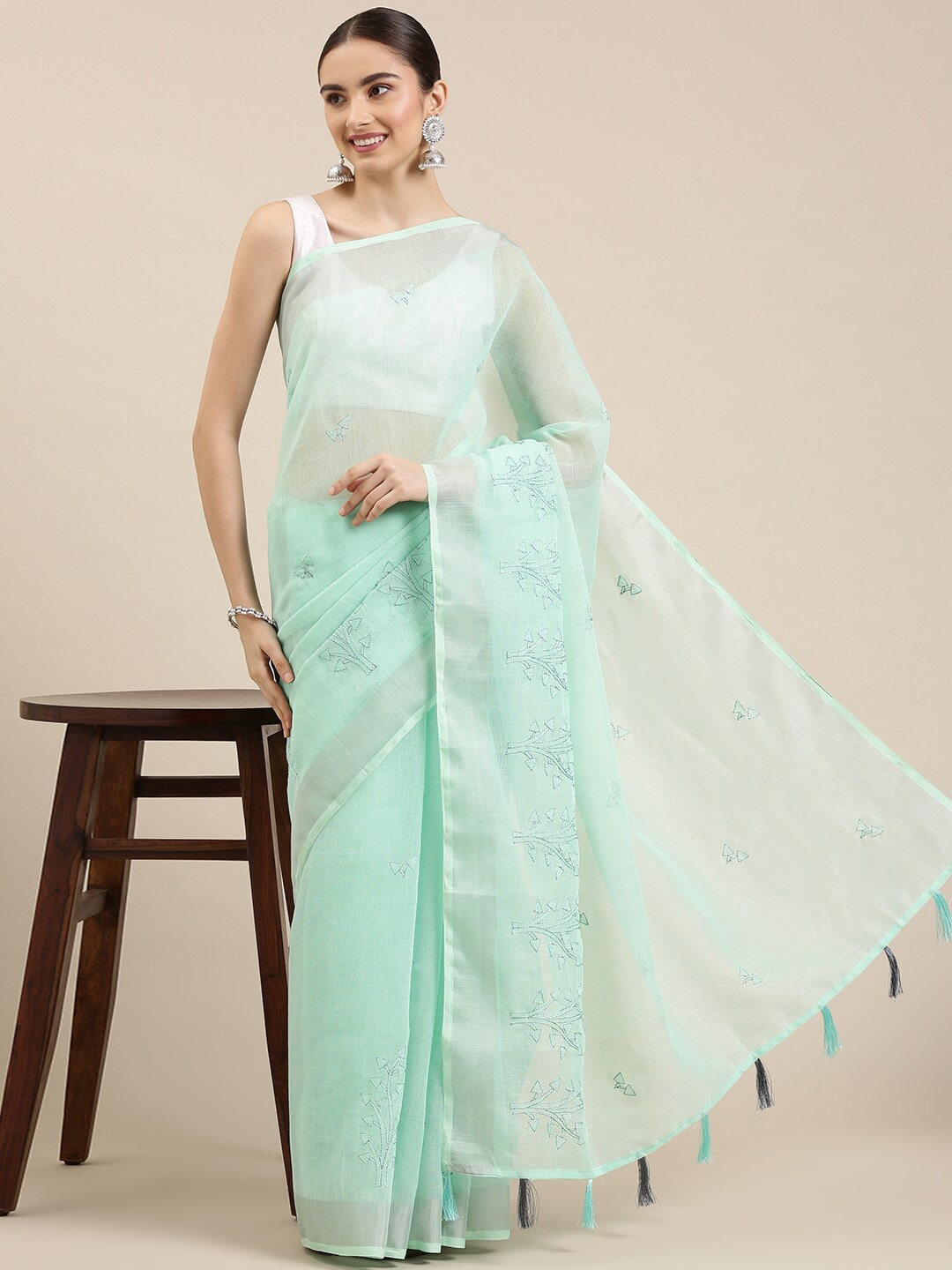 

The Chennai Silks Green & Silver-Toned Floral Embroidered Linen Blend Fusion Saree